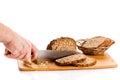 Man hand cutting bread isolated on white background Royalty Free Stock Photo