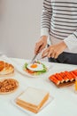 Man hand cutting fried egg on toast is cut with a knife Royalty Free Stock Photo