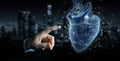 Man hand using digital x-ray of human heart holographic scan projection 3D rendering Royalty Free Stock Photo