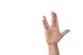 A man hand doing the Vulcan salute on a white background. Vulcan hand salute against. Spock hand. Alpha Royalty Free Stock Photo