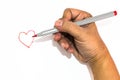 Man hand is drawing heart sign with red marker pen Royalty Free Stock Photo