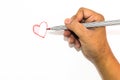 Man hand is drawing heart sign with red marker pen Royalty Free Stock Photo