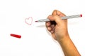 Man hand is drawing heart sign with red marker pen Royalty Free Stock Photo