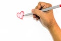 Man hand is drawing heart sign with red marker pen Royalty Free Stock Photo