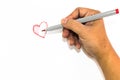 Man hand is drawing heart sign with red marker pen Royalty Free Stock Photo