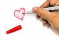 Man hand is drawing heart sign with red marker pen Royalty Free Stock Photo