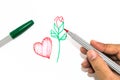 Man hand is drawing the red heart sign and green handle rose on Royalty Free Stock Photo