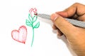 Man hand is drawing the red heart sign and green handle rose on Royalty Free Stock Photo