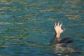 Man hand drowning in the ocean