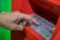 A man hand entering PIN/pass code on ATM/bank machine keypad Royalty Free Stock Photo