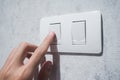 Man hand with finger on light switch. Royalty Free Stock Photo