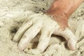 Man hand with fingers covered with white sand Royalty Free Stock Photo