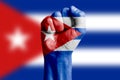 Man hand fist of CUBA flag painted. Close-up. Royalty Free Stock Photo