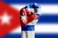 Man hand fist of CUBA flag painted. Close-up. Royalty Free Stock Photo