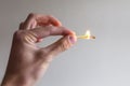 Man hand gesture with fire match