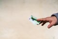 Man hand giving money like a bribe or tips. Holding EURO banknotes on a blurred background, EURO currency Royalty Free Stock Photo