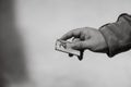 Man hand giving money like a bribe or tips. Holding EURO banknotes on a blurred background, EURO currency Royalty Free Stock Photo