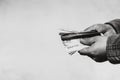 Man hand giving money like a bribe or tips. Holding EURO banknotes on a blurred background, EURO currency Royalty Free Stock Photo