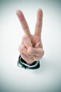 Man hand giving the V sign Royalty Free Stock Photo