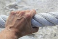 Man hand grab grip strong big aged rope Royalty Free Stock Photo