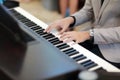 Man hand in grey suit playing piano in wedding or concert Royalty Free Stock Photo