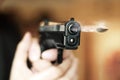 Man with hand gun pistol rubber attack violence photomanipulation Royalty Free Stock Photo