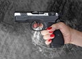 Man with hand gun pistol rubber attack violence photomanipulation Royalty Free Stock Photo