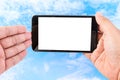 Man hand hold blank touch screen smart phone on blue sky Royalty Free Stock Photo