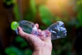 Man hand hold and crushing plastic bottle