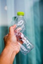 Man hand hold and crushing plastic bottle Royalty Free Stock Photo