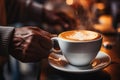 Man hand hold cup hot coffee beans cozy cafe evening relaxation calm tasty drink cocoa latte cappuccino americano Royalty Free Stock Photo