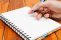 Man hand hold a pen writing on the notebook Royalty Free Stock Photo