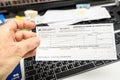 Man hand holding above computer keyboard Credit Agricole Royalty Free Stock Photo