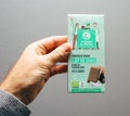 Man hand holding Artisans du Monde Vegan Chocolate