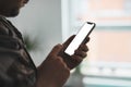 Man hand holding the black smartphone with big blank screen and modern frame less design Royalty Free Stock Photo