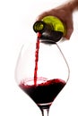 Man Hand holding Bottle filling Glass with Red Wine Royalty Free Stock Photo