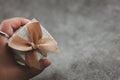 Man hand holding a box of wedding gift for guest