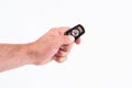 Man hand holding car remote control Royalty Free Stock Photo