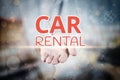 Man hand holding Car Rental text on blurry home icon property ba