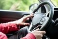 Man hand holding car steering wheel - Male hand close up shallow dof depth of field driving car - Two hands on steering wheel in Royalty Free Stock Photo