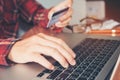 Man hand holding credit card using keyboard laptop online bank Royalty Free Stock Photo