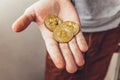 Man hand holding cryptocurrency golden bitcoin coin. Electronic virtual money for web banking and international network payment. Royalty Free Stock Photo