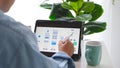 Man hand holding digital tablet with mobile app development prototype while working at home Royalty Free Stock Photo
