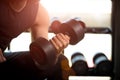 Man hand holding dumbbell exercise in gym. Fitness muscular body Royalty Free Stock Photo