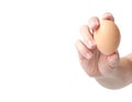 Man hand holding egg on white background Royalty Free Stock Photo