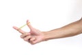 A man hand holding elastic rubber band on white background. Royalty Free Stock Photo