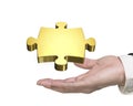 Man hand holding golden puzzle piece Royalty Free Stock Photo