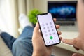 Man hand holding iPhone X with call number on screen Royalty Free Stock Photo