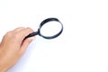 Man hand holding  Magnifying glass  isolate on a white background Royalty Free Stock Photo