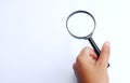 Man hand holding  Magnifying glass  isolate on a white background Royalty Free Stock Photo